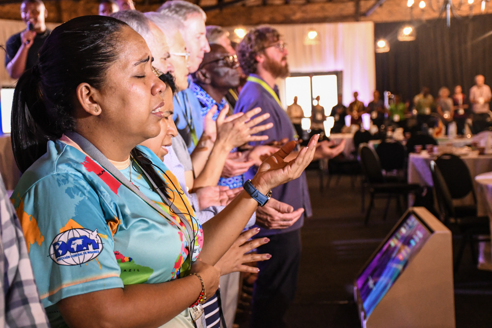Participants worship together at the close of the Global Gathering